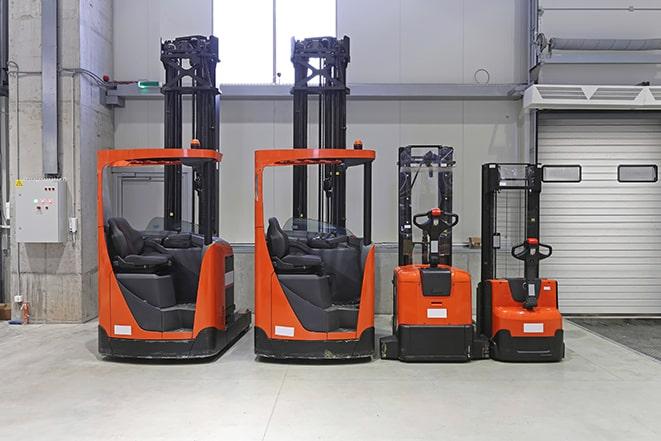 forklifts with operators loading pallets